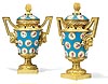 An extremely fine pair of Louis XVI gilt bronze mounted bleu celeste Sèvres porcelain pot-pourri vases and covers